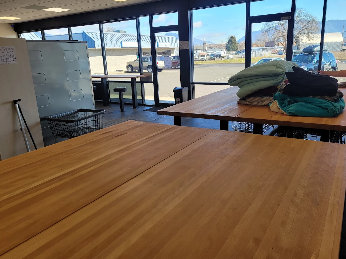 Folding tables in front of the storefront windows