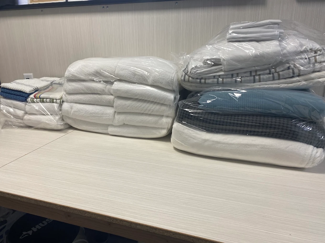 Neatly folded and bagged laundry, Wash 'N Fold service